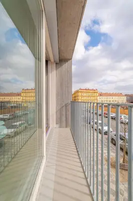 a balcony with a view of a parking lot at IndustriaLux Suite by Rentez in Prague