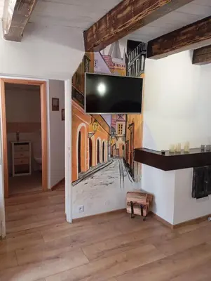 a living room with a mural on the wall at Prague centrum house in Prague