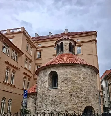 a building with a clock tower in front of it at Prague centrum house in Prague