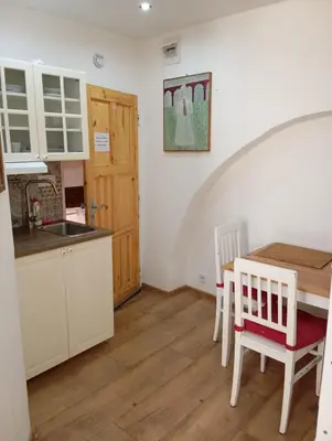 a kitchen and dining room with a table and chairs at Prague centrum house in Prague