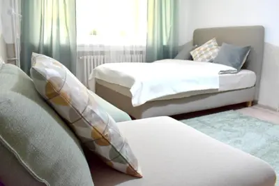 a living room with two beds and a couch at Prague City Centre Apartment in Prague
