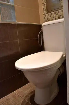a bathroom with a white toilet in a room at Prague City Centre Apartment in Prague