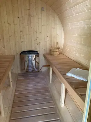 a small room with a table in a sauna at Chillzóna u Medojeda in Chyňava