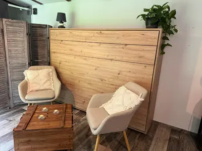 two chairs and a table in a room at Chillzóna u Medojeda in Chyňava