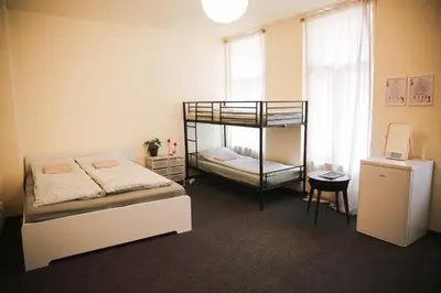 a bedroom with two bunk beds and a window at Koreatown in Prague