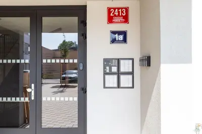 a door to a building with a sign on it at SKYLINE PRAGUE Apartments in Prague