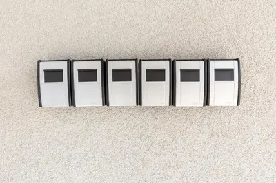 a row of white doors on a wall at SKYLINE PRAGUE Apartments in Prague