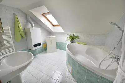 a bathroom with a tub and a sink at Old Town Apartments Tyn in Prague