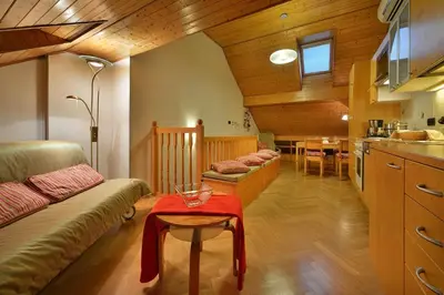a living room with a couch and a table at Old Town Apartments Tyn in Prague