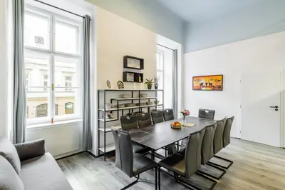 a dining room with a table and chairs at Large Historic Home by Charles Bridge & Parking in Prague