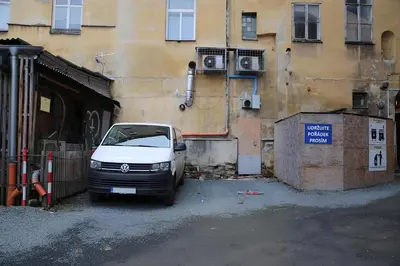 a white van parked in front of a building at Large Historic Home by Charles Bridge & Parking in Prague