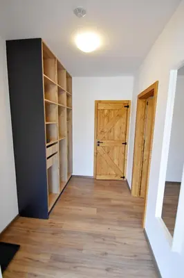 an empty room with a door and wooden floors at PENZION u Restaurace Na Koreji in Štětí