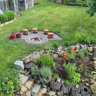 a garden with a fire pit in the yard at Votice Luční in Wotitz