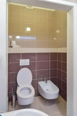 a bathroom with a toilet and a sink at Modern Apartment Navrátilova II in Prague