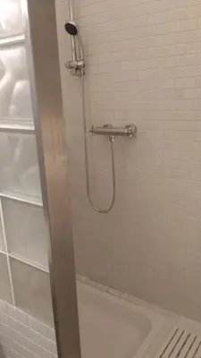 a shower in a bathroom with a bath tub at Modern Apartment Perlova in Prague
