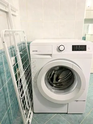 a washing machine in a room with a wall at Modern Apartment Krakovska in Prague