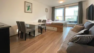 a living room with a couch and a table at Matilda108 in Prague