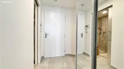 a glass door in a room with a shower at Matilda108 in Prague