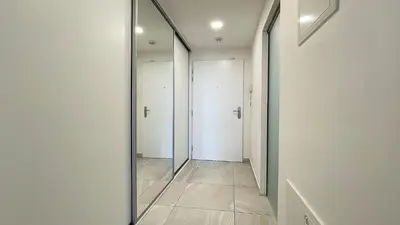 a mirror in a hallway with white doors at Matilda108 in Prague