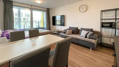 a living room with a table and a couch at Matilda108 in Prague