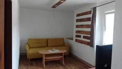 a living room with a couch and a table at Ubytování Ždírec - Apartmán 2 in Ždírec