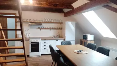 a kitchen and dining room with a table and chairs at Ubytování Ždírec - Apartmán 2 in Ždírec