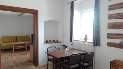 a dining room with a table and chairs and a window at Ubytování Ždírec - Apartmán 2 in Ždírec