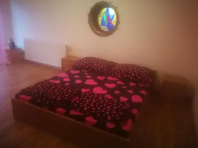 a room with a bed with pink hearts on it at Vila Barrandovská patro 2 in Prague