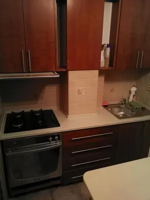 a kitchen with a stove and a sink at Vila Barrandovská patro 2 in Prague