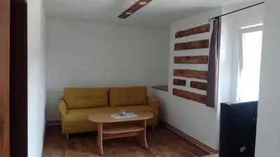 a living room with a couch and a table at Ubytování Ždírec - Apartmán 1 in Ždírec