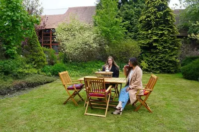 a group of chairs and a glass table and a glass table at Lavender Apartment - perfect for families! in Stranný