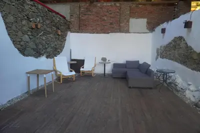 a woman jumping off a hill in a field at Lavender Apartment - perfect for families! in Stranný