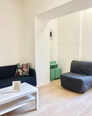 a living room with a couch and a coffee table at Cozy Atmos Apartments in Prague