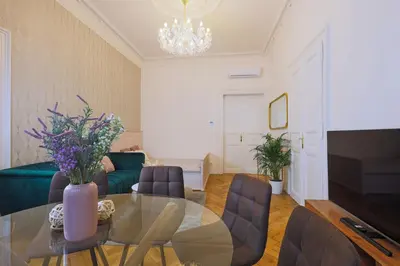 a living room with a glass table and chairs at National Theatre Elegance Residence in Prague