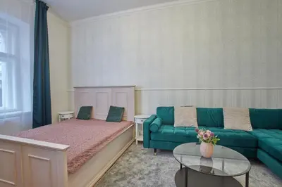 a living room with a bed and a couch at National Theatre Elegance Residence in Prague