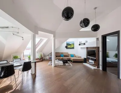 a living room with a couch and a table at Luxury apartment with terrace and garage in Prague