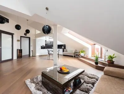 a living room with a couch and a table at Luxury apartment with terrace and garage in Prague