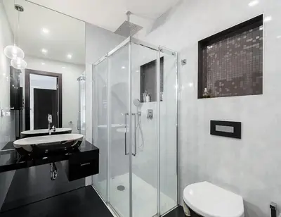 a bathroom with a shower and a sink and a toilet at Luxury apartment with terrace and garage in Prague