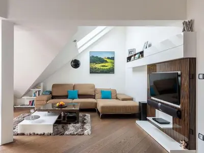 a living room with a couch and a television at Luxury apartment with terrace and garage in Prague