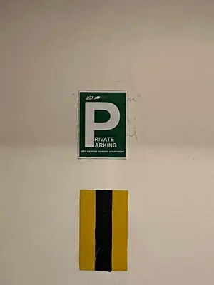 a sign on a wall that says private parking at City Centre Apartment with Parking in Prague