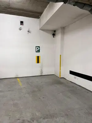 a white room with a p on the wall at City Centre Apartment with Parking in Prague