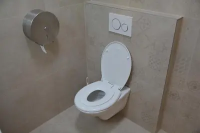 a bathroom with a white toilet in a stall at New City Centre Garden Apartment - Central Location in Prague