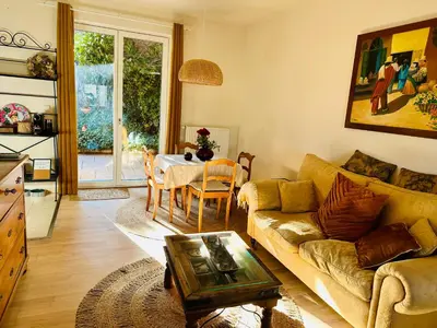 a living room with a couch and a table at Nature Nest in Prague