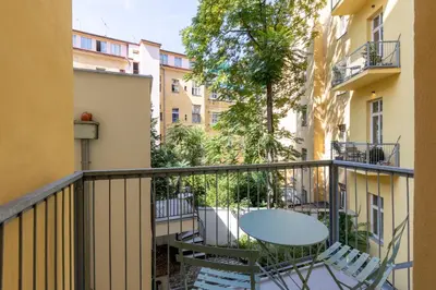 a balcony with a table and chairs at Quiet and stylish apartment near Wenceslas Square in Prague