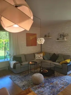 a living room with a couch and a table at Apartmán v Praze 6, Sedlec in Prague