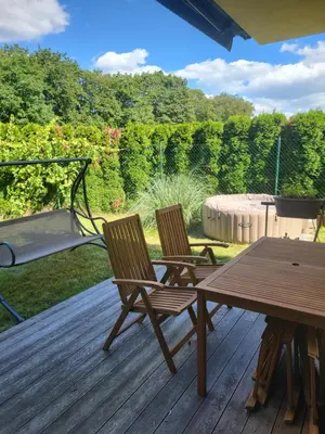 two chairs and a picnic table on a deck at Apartmán v Praze 6, Sedlec in Prague