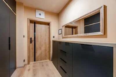 a bathroom with a black cabinet and a mirror at Penzion U Mě in Obora