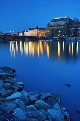 a large body of water with buildings in the background at Green Park View apartment in Prague