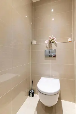 a bathroom with a white toilet in a room at Rezidence Garden Towers - studio s parkováním in Prague