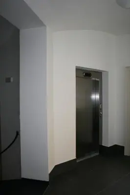 a elevator in a room with a white wall at Apartment Sophia in Prague